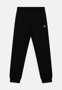 Pantalones deportivos negros hechos de material suave, con una cinturilla elástica con cordón, puños acanalados y un pequeño logo en el muslo izquierdo.
