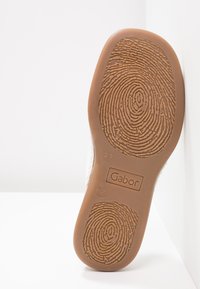 Brown rubber outsole with textured grip pattern and circular designs. Features "Gabor" branding and size "37" embossed on the heel.