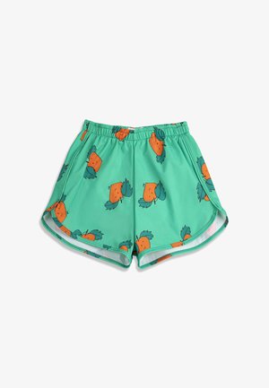 Pantalones cortos verdes para niños con cintura elástica y patrón de zanahorias naranjas sonrientes con hojas verdes.