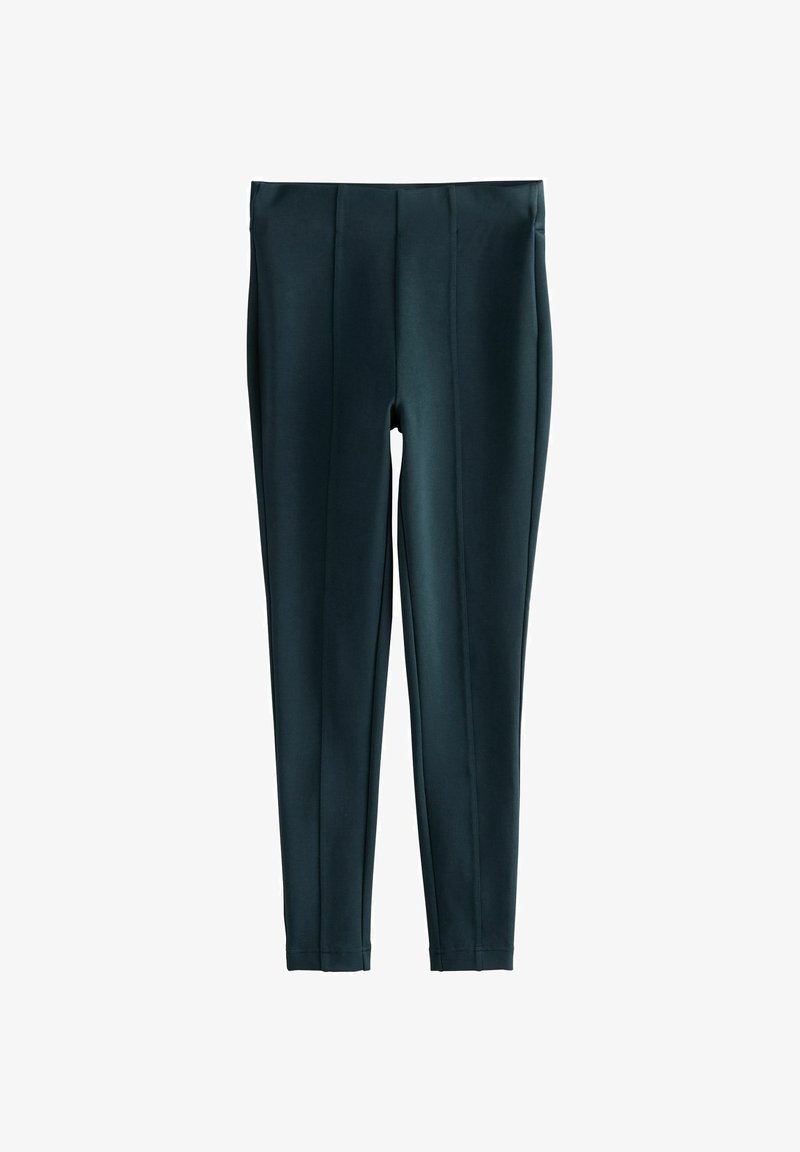 Leggings vert foncé en tissu extensible, dotés d'une texture lisse, d'une coupe ajustée et de coutures verticales subtiles sur le devant.