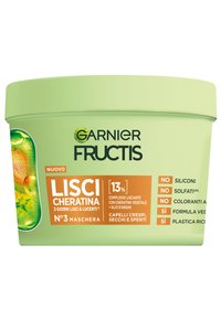 Contenitore circolare verde etichettato "Garnier Fructis Lisci Cheratina." Contiene dettagli sulla maschera per capelli con ingredienti e note ecologiche sul lato.