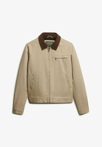 Veste beige avec un col en velours côtelé marron, fermeture éclair, deux poches latérales et une poche poitrine. La texture du tissu est lisse et le design est décontracté.