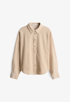Beige corduroy long-sleeve shirt with pointed collar and snap button closure, displayed against a white background.