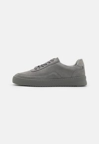 Gray leather sneakers with a smooth finish and suede panels. Features a thick rubber sole and matching gray laces. Minimalist design.