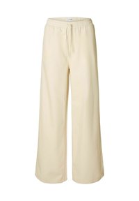 Pantalons larges beige clair avec une taille élastique et un cordon de serrage. Fabriqués à partir d'un tissu doux, présentant des détails de couture minimalistes.
