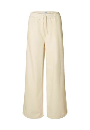 Pantaloni a gamba larga color crema con vita elasticizzata e cordoncino. Realizzati in un tessuto morbido, presentano dettagli di cucitura minimi.