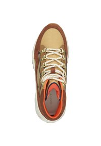 Brown and tan sneaker featuring a mix of suede and fabric, gold eyelets, white laces, and an orange inner lining. Round toe design.