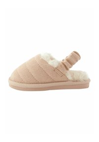 Pantoufle beige à enfiler avec doublure en fourrure douce, dessus texturé et boucle élastique à l'arrière. Forme élégante et profilée avec une semelle plate.