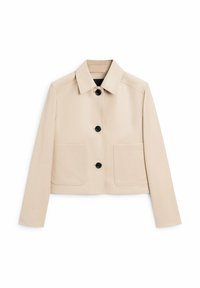 Beige cropped jakke lavet af glat stof, med krave, foran knaplukning og to store forlommer. Sorte knapper fremhæver designet.