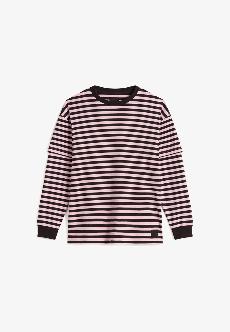 Long-sleeve crewneck shirt with pink and black horizontal stripes, black cuffs, and a small black patch near the bottom hem on a white background.