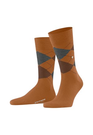 Calze marroni con motivo argyle e bordo a costine. Presentano forme a diamante in marrone scuro e teal. Tessuto morbido e punta rinforzata.