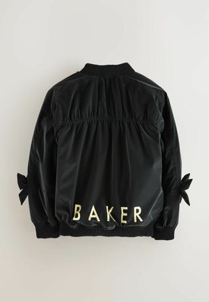 Giacca bomber nera in nylon con retro arricciato, polsini a coste e lacci sulle maniche. Scritta "BAKER" in lettere dorate sul retro.