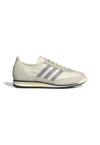 Light beige retro sneakers with purple stripes, suede and mesh material, textured upper, and a rubber sole with a contrasting cream accent.