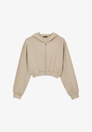 Felpa beige accorciata realizzata in morbido tessuto, dotata di zip frontale, maniche lunghe con polsini elasticizzati e cappuccio con lacci.