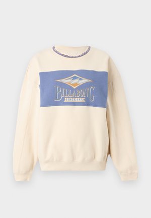 Sudadera cremosa con panel azul en el pecho con el logo de Billabong y texto "Since 1973", diseño de ola en el ribete del cuello.