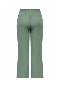Lysegrønne teksturerte bukser med elastisk midjebånd, med et kort og bredt ben-design. Ingen lommer eller synlige maskinvare detaljer.