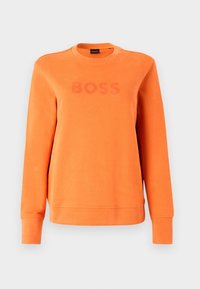 Orange sweatshirt with long sleeves, crew neckline, and a textured fabric. Features a prominent "BOSS" logo in matching color across the chest.