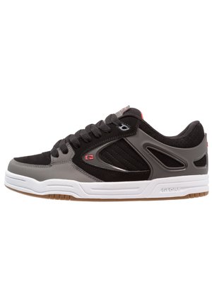 Low-top sneaker with black and gray panels, black laces, red logo accents, and white sole with gum outsole, viewed from the side.