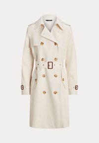 Beige dubbelknäppt trenchcoat med sköldpaddsartade knappar, bälte i midjan, fickor med klaff, axelapplikationer och spännen på ärmarna.