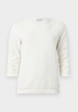 Hvid langærmet sweatshirt med et tekstureret mønster, rund halsudskæring og ribbede manchetter. Blødt materiale med en afslappet pasform.