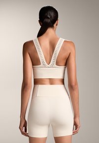 OYSHO COMPRESSIVE CUTWORK - Top - beige
