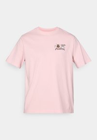 Lyserosa bomull T-skjorte med korte ermer. Har et lite, brodert design på venstre brystområde med tegneserieelementer og tekst.
