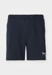 Navy blue athletic shorts made of soft material, featuring an elastic waistband with a drawstring and a logo on the lower side.