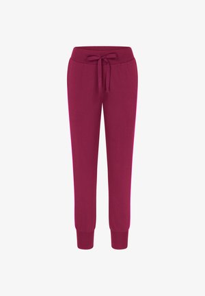 Fleece joggingbroek in diep magenta met een rekbare tailleband, verstelbaar trekkoord en fitted boorden bij de enkels. Glad textuur.