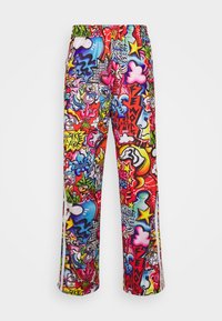 Colorful printed pants feature a vibrant graffiti design with various shapes and patterns. Material appears smooth with a relaxed fit and elastic waistband.