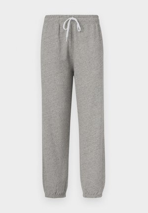 Pelēkas sporta bikses ar elastīgu jostasvietu un baltu auklu. Manžetes arī ir elastīgas, izgatavotas no mīksta, teksturēta auduma.