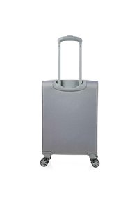 Maleta rígida gris con asa retráctil y cuatro ruedas. Textura lisa, forma rectangular y diseño minimalista.