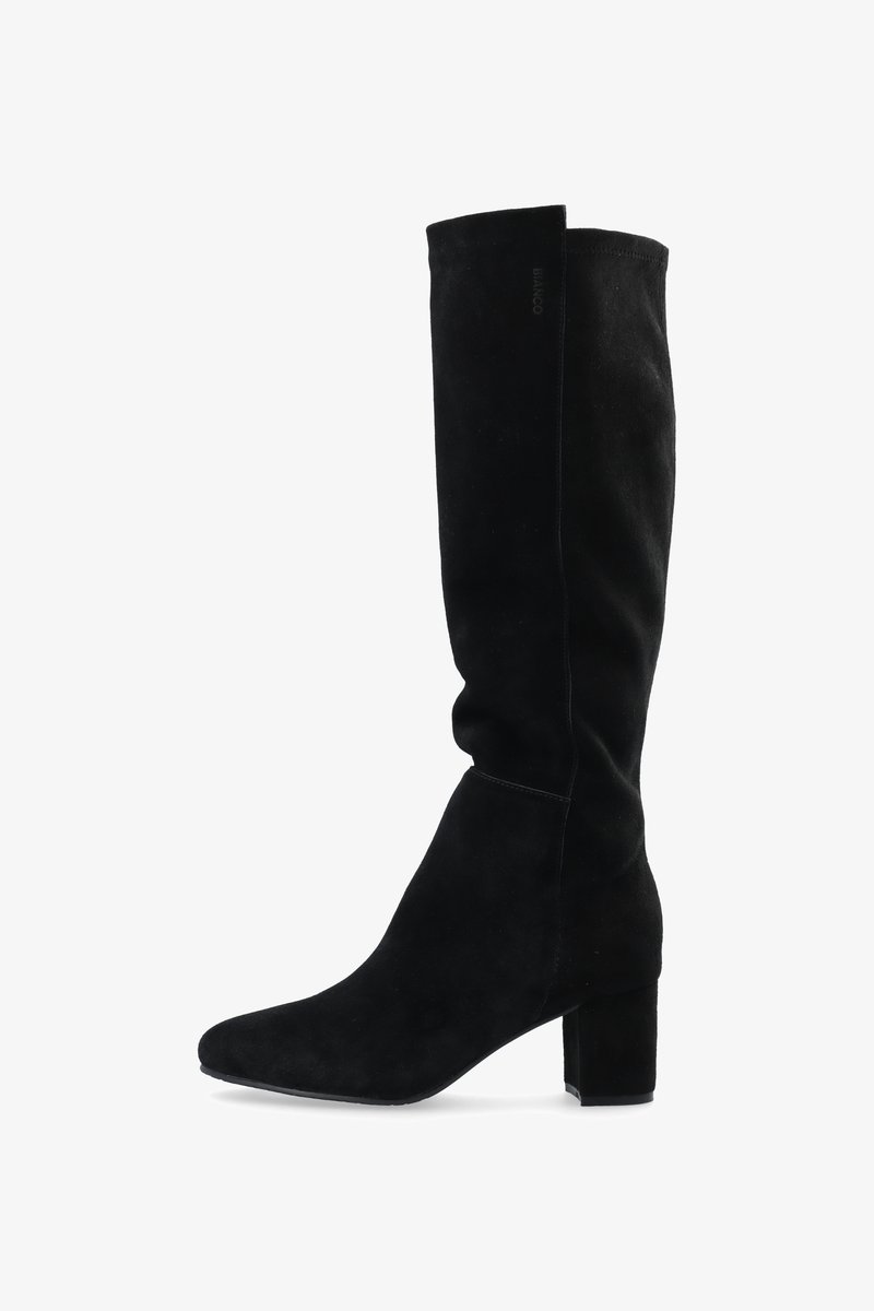 Black knee-high boots in soft suede. Features a pointed toe, smooth texture, and a block heel. Minimalist design with no visible hardware.