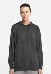 Kapuzenpullover in schiefergrau mit langen Raglanärmeln, verstellbarem Kordelzug sowie gerippten Bündchen und Saum. Weiche Textur, lässiges Design.