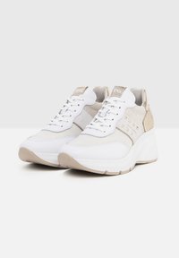 White and beige sneakers featuring mesh and leather materials, lace-up design, flat rubber soles, and metal accents on the side.