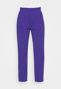 Purple tapered pants with an elastic, ruffled waistband, featuring front pleats and smooth texture, designed for a fitted silhouette.