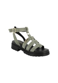 Groene suede sandalen met banden en een zwarte zool, met een gespsluiting en een stevige plateauzool voor extra comfort en stabiliteit.