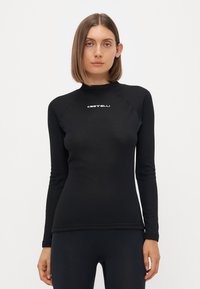 Black long-sleeve top made of stretchy fabric with a high neckline and raglan sleeves, featuring a white "Castelli" logo on the chest.