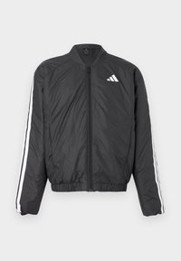 Zwart bomberjack met lange mouwen, elastische tailleband, ritssluiting over de hele lengte, en witte strepen langs de mouwen. Gemaakt van lichtgewicht materiaal.