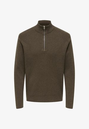 Brūns džemperis ar augstu apkakli un pusapaļo rāvējslēdzēju priekšpusē, ar ribotu tekstūru un garām piedurknēm. Mīksts adīts materiāls.