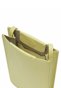 Rectangular light yellow leather bag with open top. Inside features a smooth lining and a circular snap closure. Simple, unadorned design.