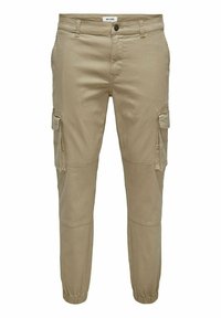 Pantalons cargo beiges avec des poignets élastiques, dotés de plusieurs poches latérales et d'une coupe légèrement fuselée. Fabriqués en tissu durable en mélange de coton.