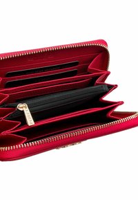 Red zippered wallet with RFID protection, featuring multiple card slots, black lining, and gold-toned hardware for opening and closure.