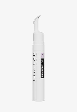 White cylindrical serum bottle with a curved applicator tip, labeled "IDOLAB TRI-PEPTIDE 2%," featuring a clean and modern design.