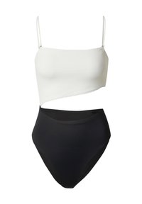 Twee-delige badmode set met een witte asymmetrische top met dunne bandjes en hoge zwarte broekjes. Zachte, rekbare stof.