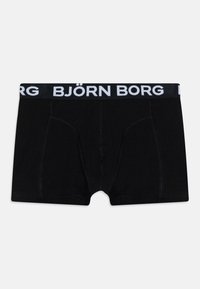 Boxer shorts negros fabricados con material suave y un ajuste ceñido. Presenta un logo en blanco "BJÖRN BORG" en una cinturilla negra.