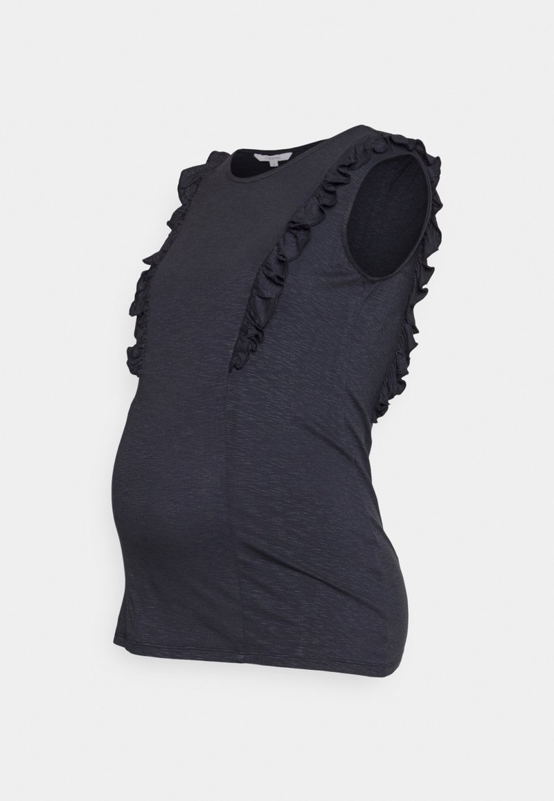 Graviditetslinne i mörkgrått tyg med en slät textur. Har vertikala volanger framtill och är utan ärmar.