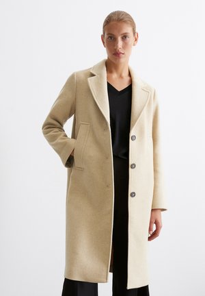 Light beige wool coat with a tailored design, notch lapels, two front pockets, and three buttons down the front. Smooth, soft texture.