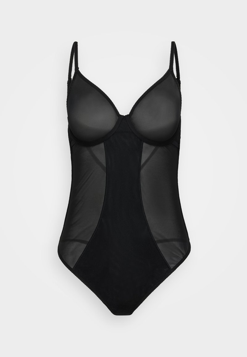 Must mustrakk mustrakk, mis on läbipaistmatud topsid, läbipaistvad paneelid, reguleeritavad rihmad ja sile tekstuur, istuv siluett ja minimaalne detailide hulk.