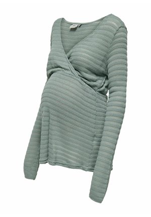 Pull de maternité en maille vert clair avec manches longues et décolleté en V cache-cœur.