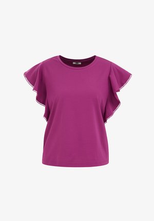 Lila Bluse mit kurzen Ärmeln, Rundhalsausschnitt und Rüschen an den Ärmeln, die mit kleinem kreisförmigen Besatz an den Kanten verziert sind.